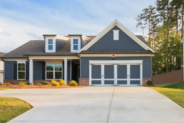 A house featuring a concrete driveway installed by TJ Concrete Contractor team in Texas