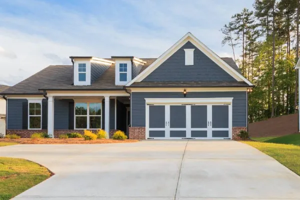 A house in New Braunfels, TX featuring a new driveway built by the TJ Concrete Contractor team